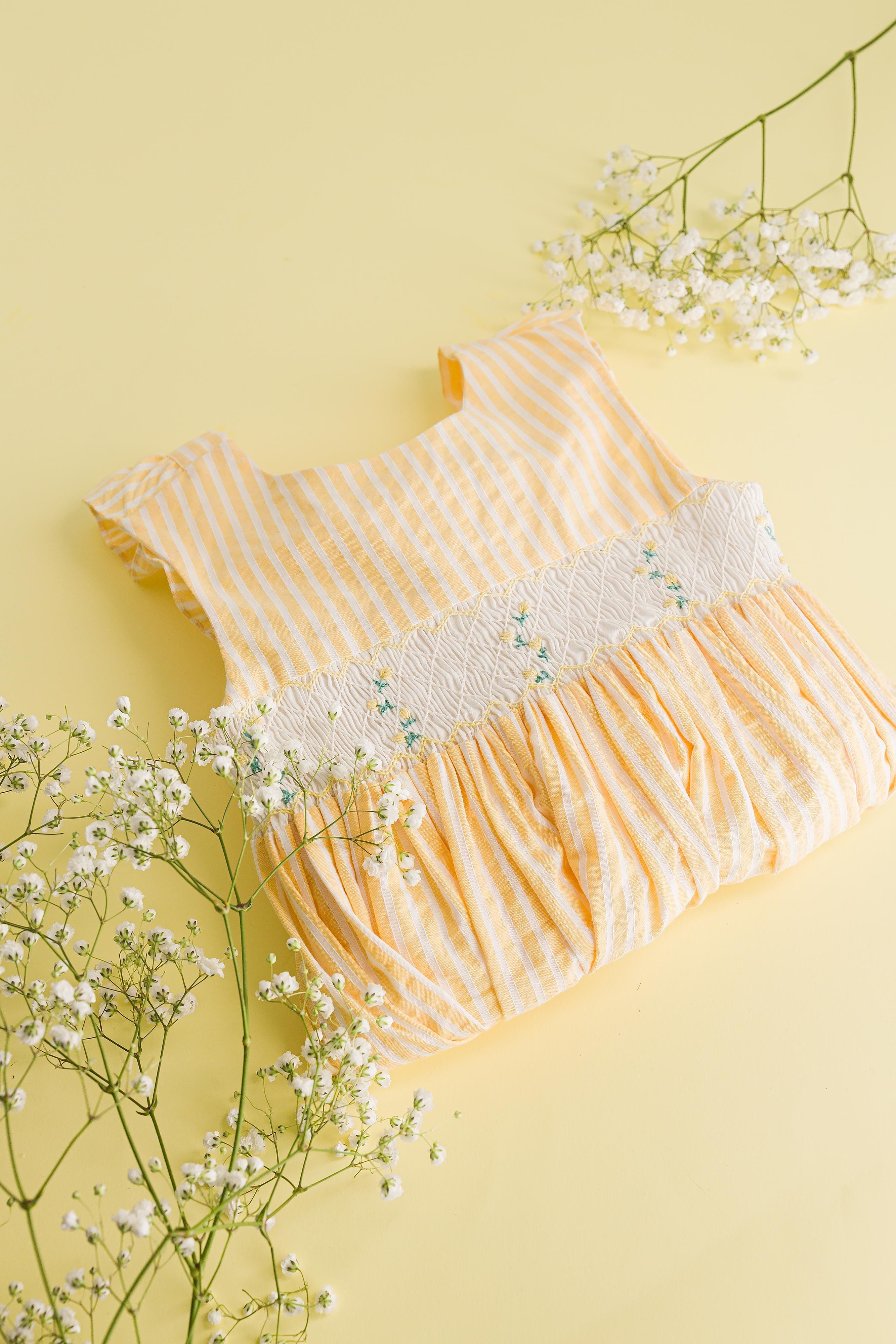 Bégonia, smocked dress with ruffled straps on back, in Yellow and white seersucker stripes