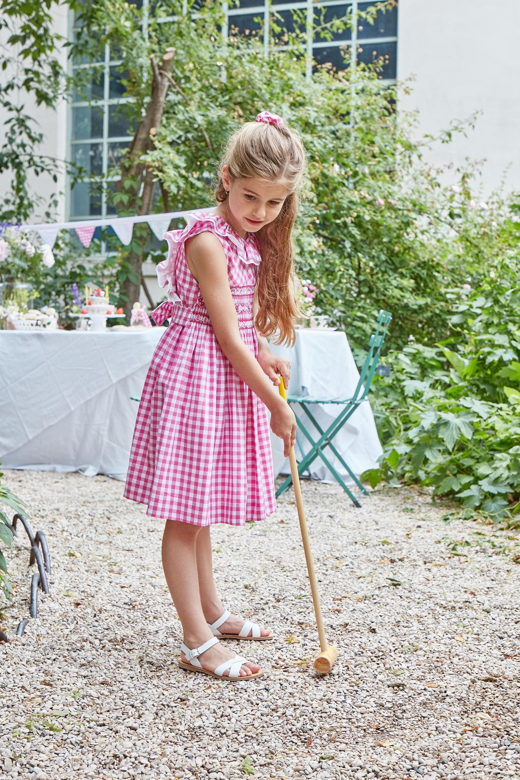 Mélina, smocked dress with two rows of ruffles at the neckline and back, in Large fuchsia gingham