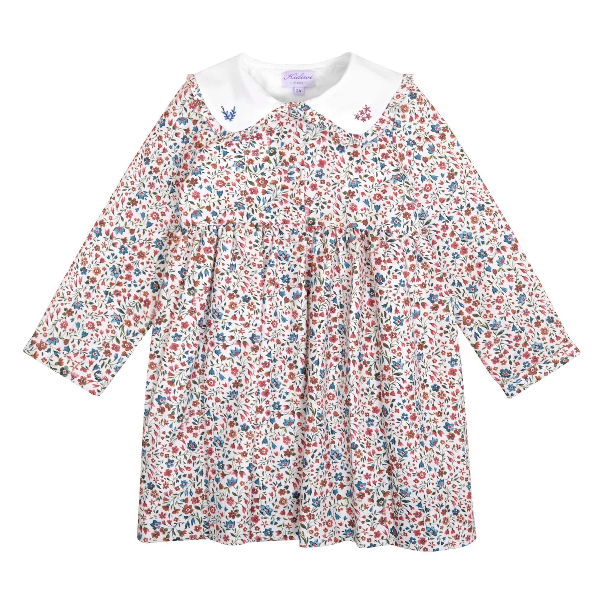 Vanille, Robe à manches longues, grand col smocké à volants, ouverture sur le devant, en imprimé fleurs de Noël  - Vanille, Long-sleeved dress, large ruffled smocked collar, opening on the front, in Christmas flower print