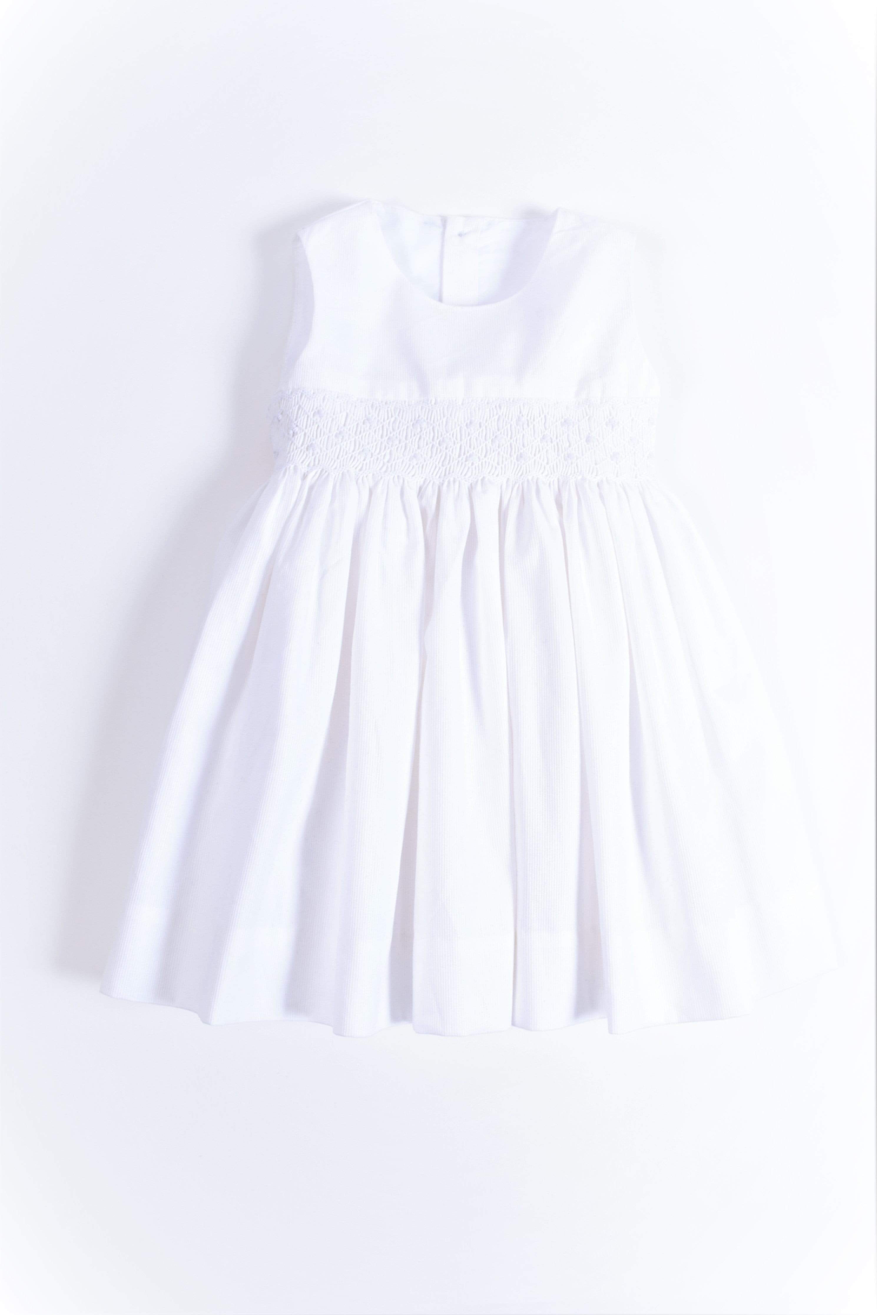 Smocked sleeveless white pique dress